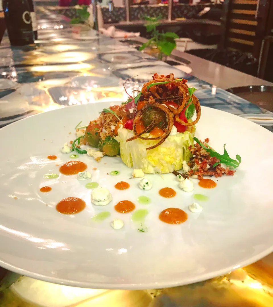 A fine-dining plate with sauces