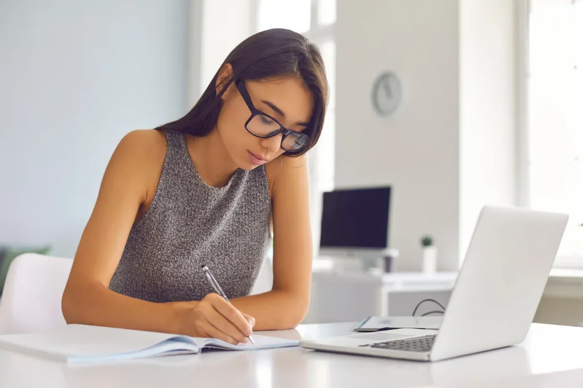 A young female home buyer contemplating submitting her loan estimate for review