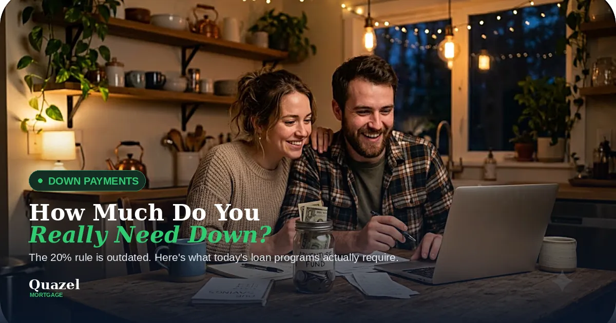 Young couple smiling together in a cozy kitchen reviewing paperwork and a laptop, discussing down payment plans