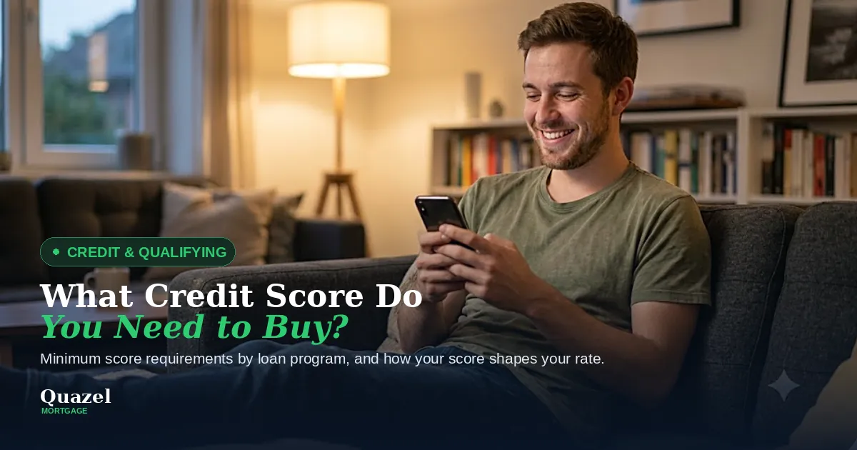 A living room with a man sitting on a couch searching on his phone. Title says "what credit score do you need to buy?"