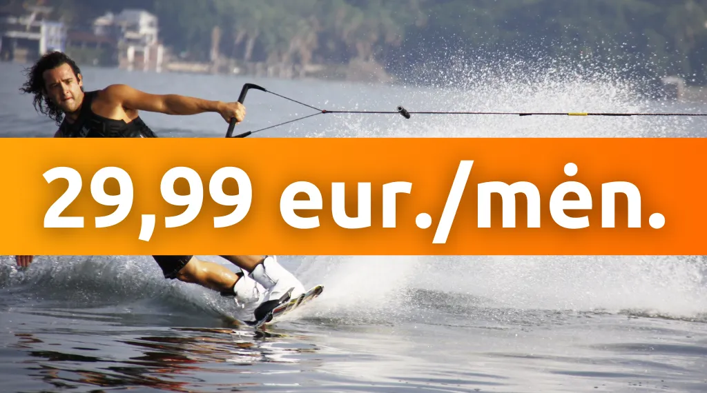 A man doing a kickbox kick in a gym