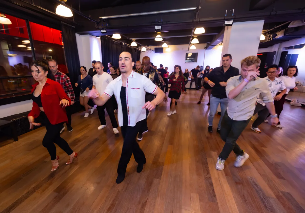 A full salsa class in session at Pearl Studios in Manhattan