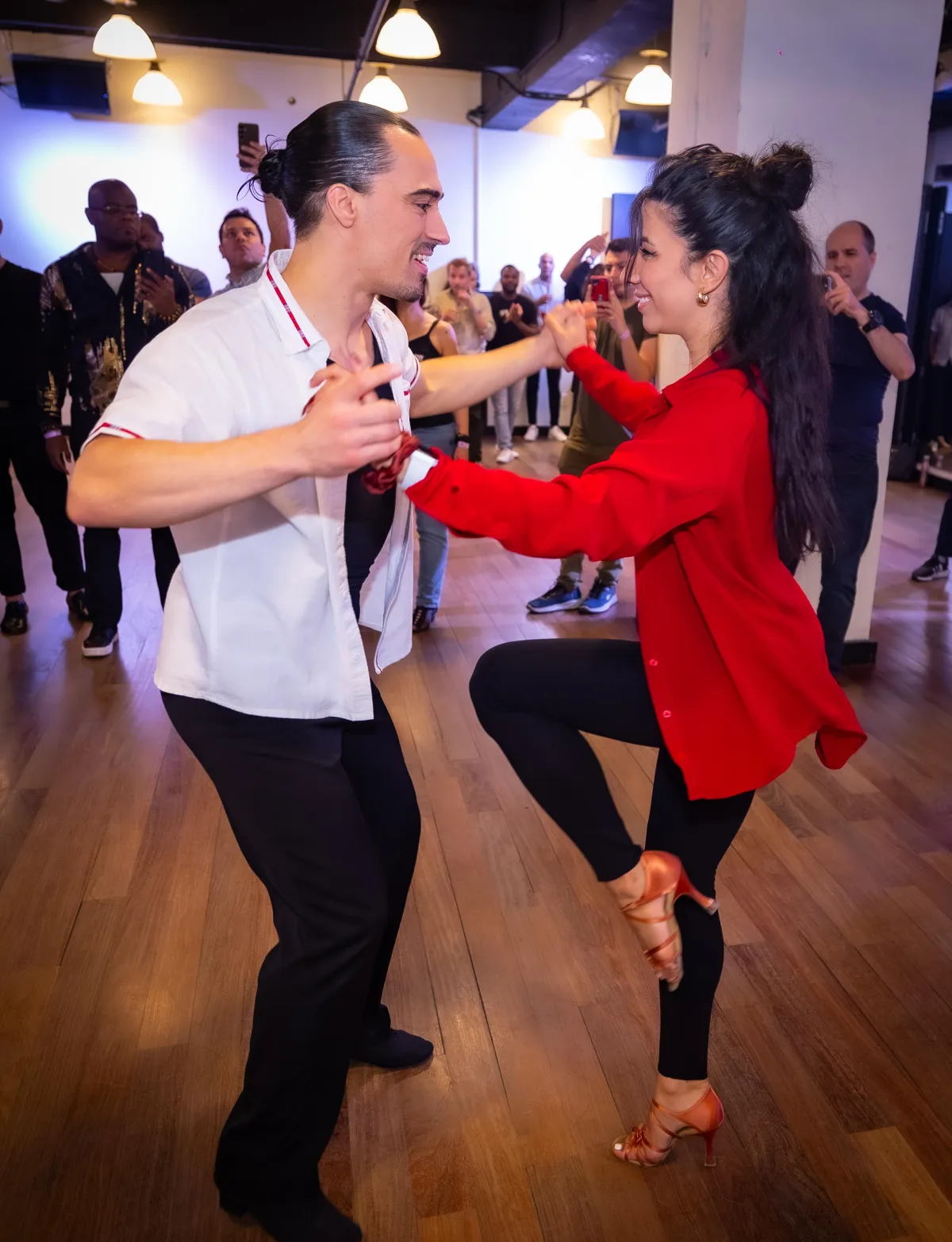 Hunter Houde showing a salsa turn with his partner