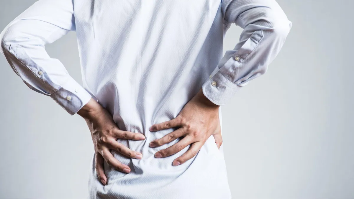 Man holding lower back image for Chronic Pain relief hypnosis program