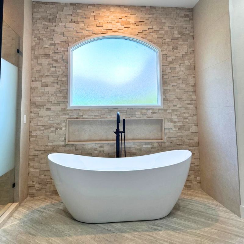 Austin bathroom remodel with freestanding tub and custom tile surround