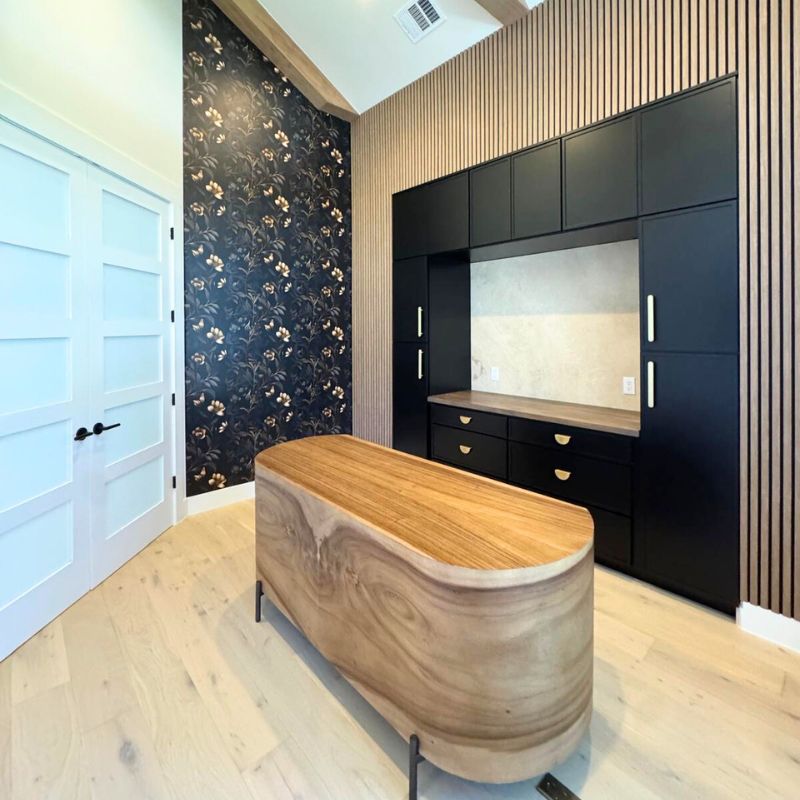 Contemporary Austin office with custom media wall and wood slat accents