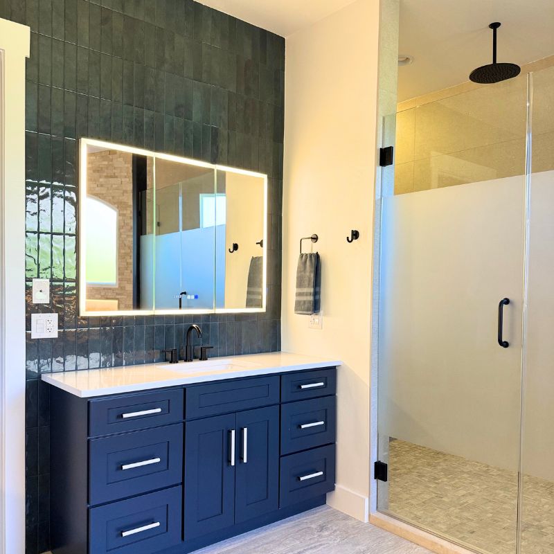 Austin bathroom remodel with modern lights, sleek design and large walk-in shower