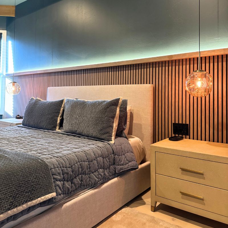 Luxury bedroom transformation with wood slat walls & modern pendant lights Austin