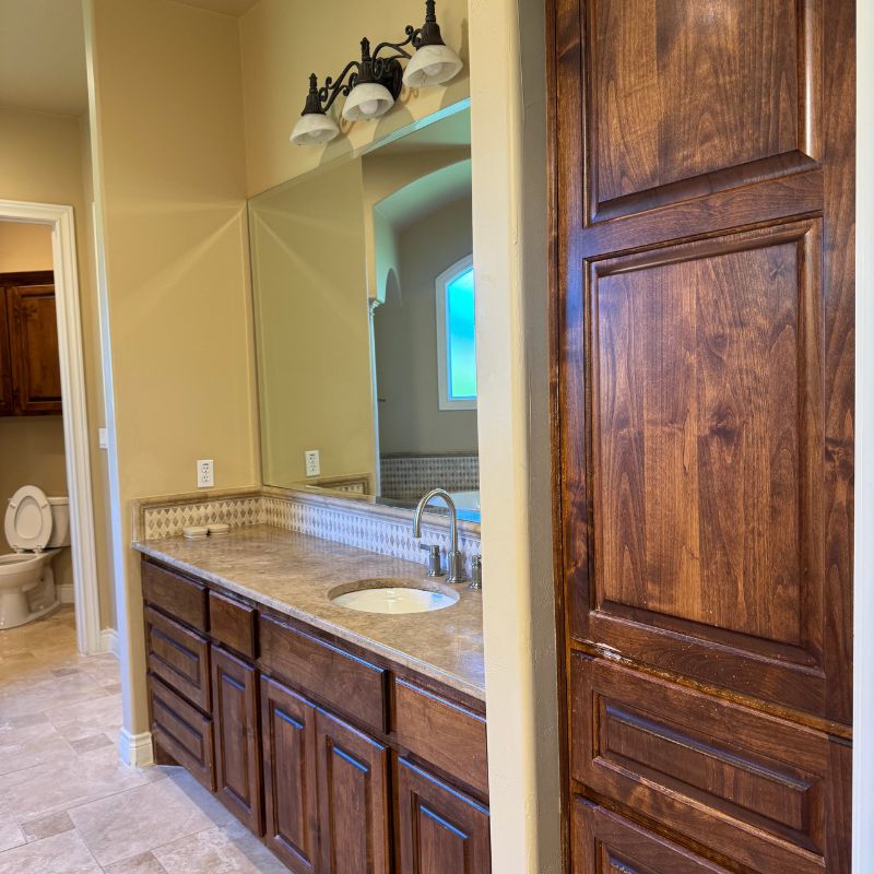 Before full home remodel in Austin TX - outdated master bathroom room with wood accents