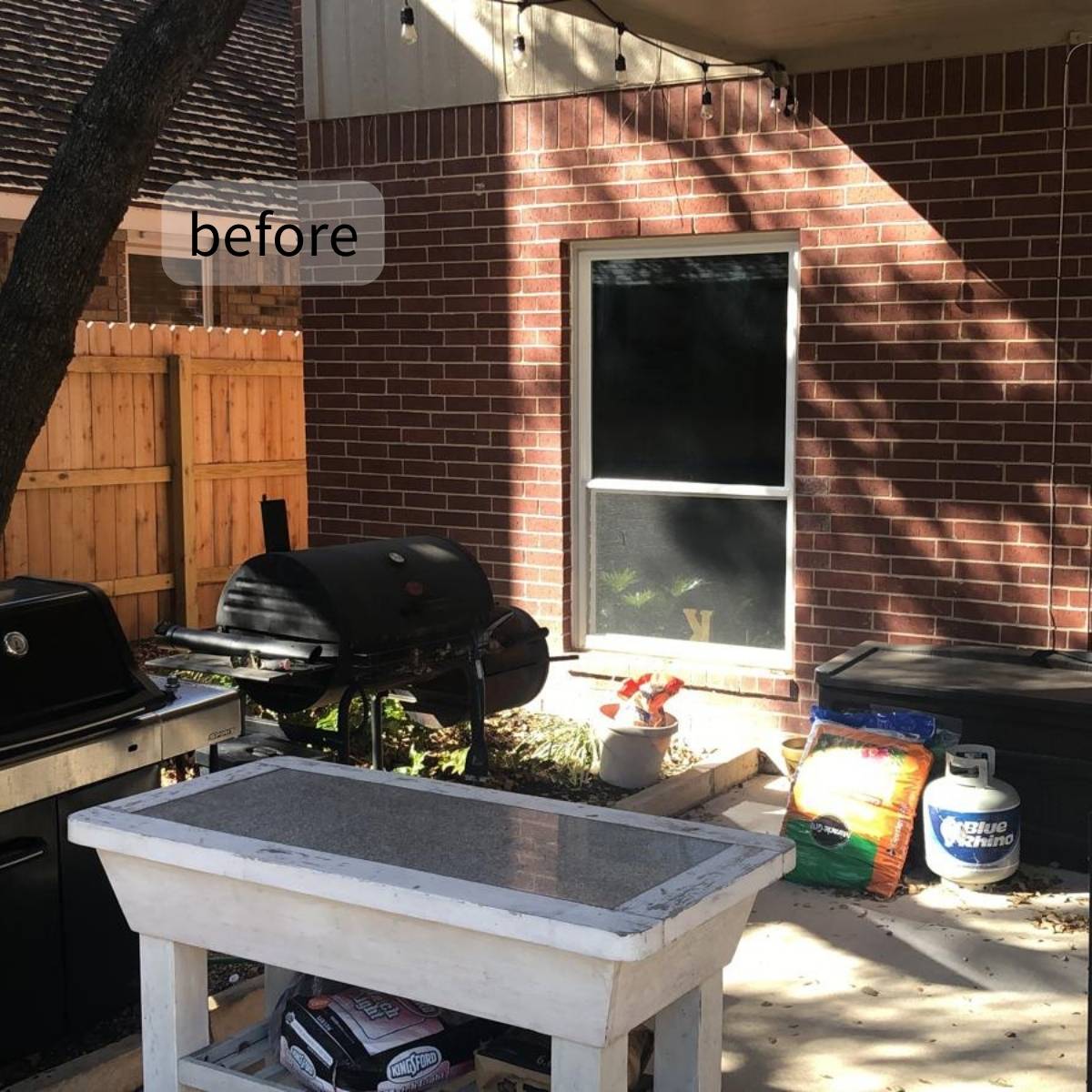 Before: bare Austin backyard patio with no outdoor kitchen