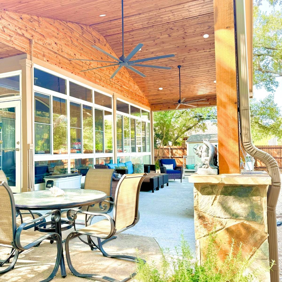 After: custom Austin outdoor kitchen with built-in grill, stone island, and pergola