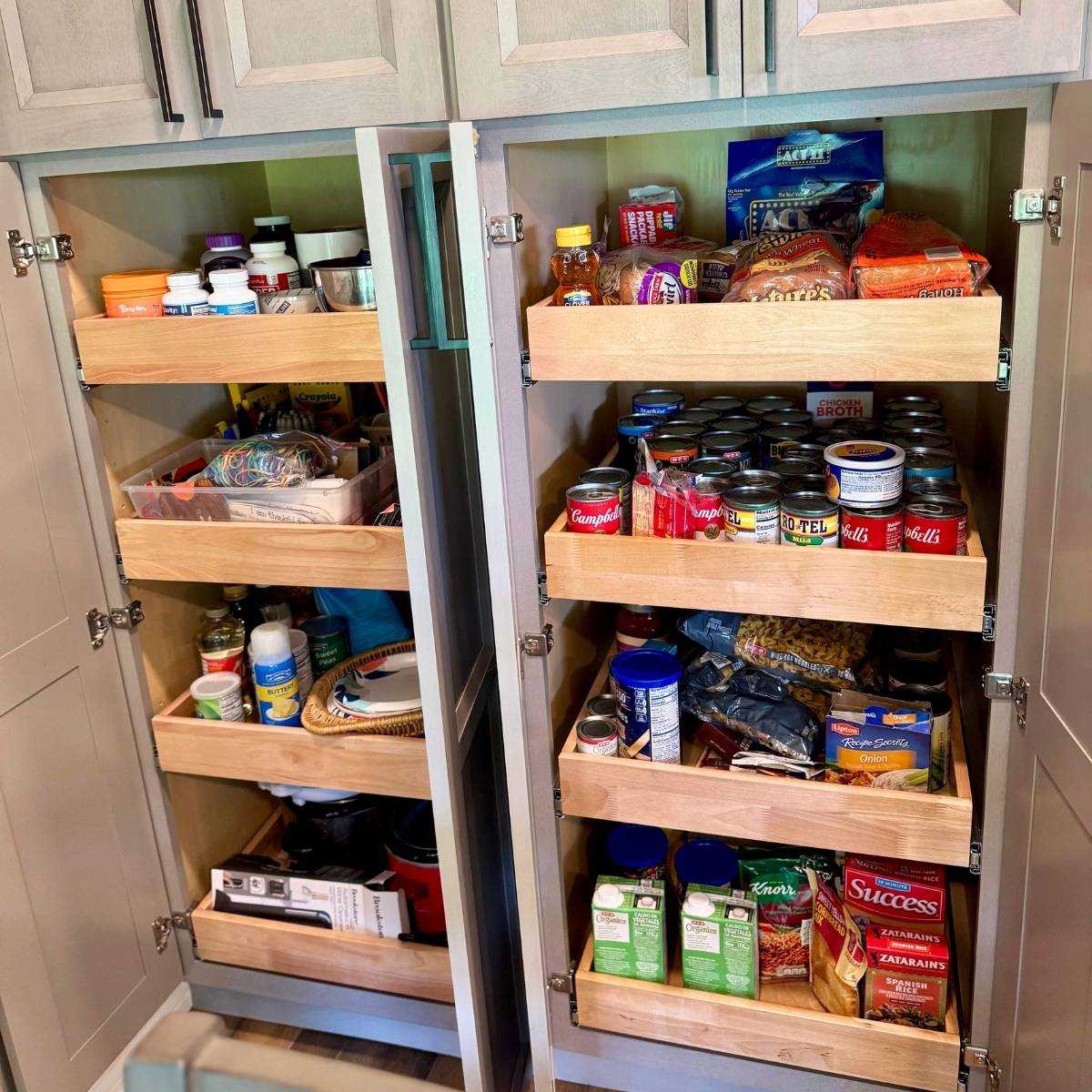 After: Contemporary Austin kitchen by ATX Custom Remodel featuring pull out cabinet drawers for organization