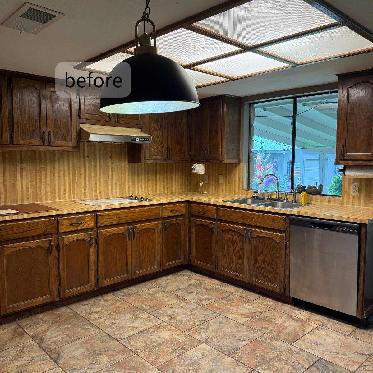 Before: 1970s Austin kitchen before transformation - dark cabinets and low ceiling