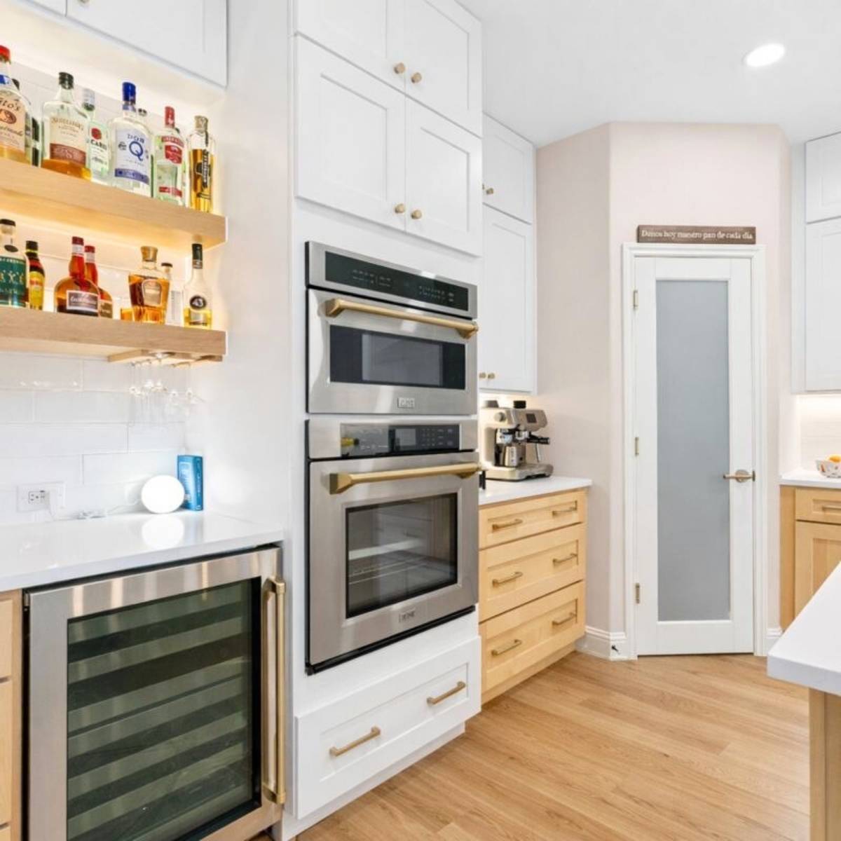 After: Custom Austin TX dream kitchen by ATX Custom Remodel - open concept layout and lit up floating shelves
