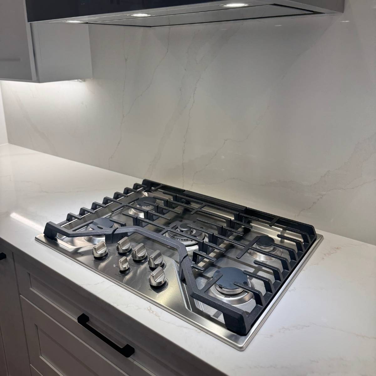 After: Contemporary Austin kitchen by ATX Custom Remodel featuring stainless appliances