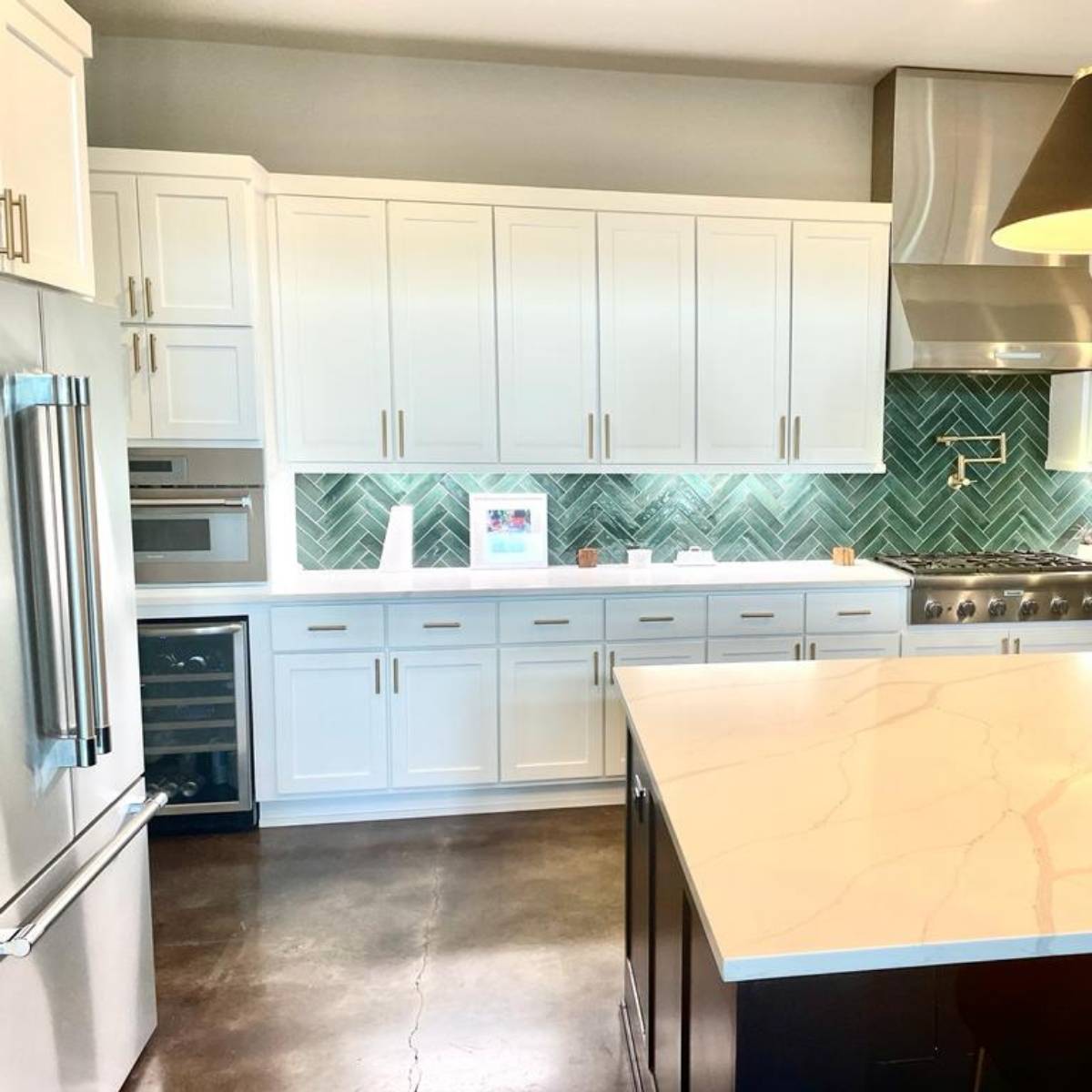 After: Custom Austin TX dream kitchen by ATX Custom Remodel - white cabinets & large quartz island with sink