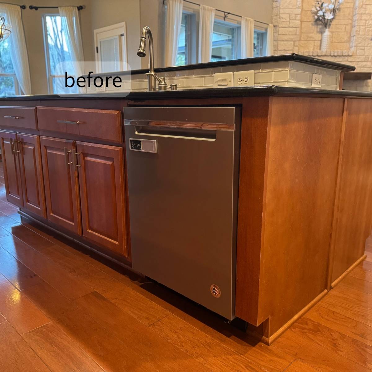 Before: Outdated Austin home kitchen with dark fixtures, and poor lighting