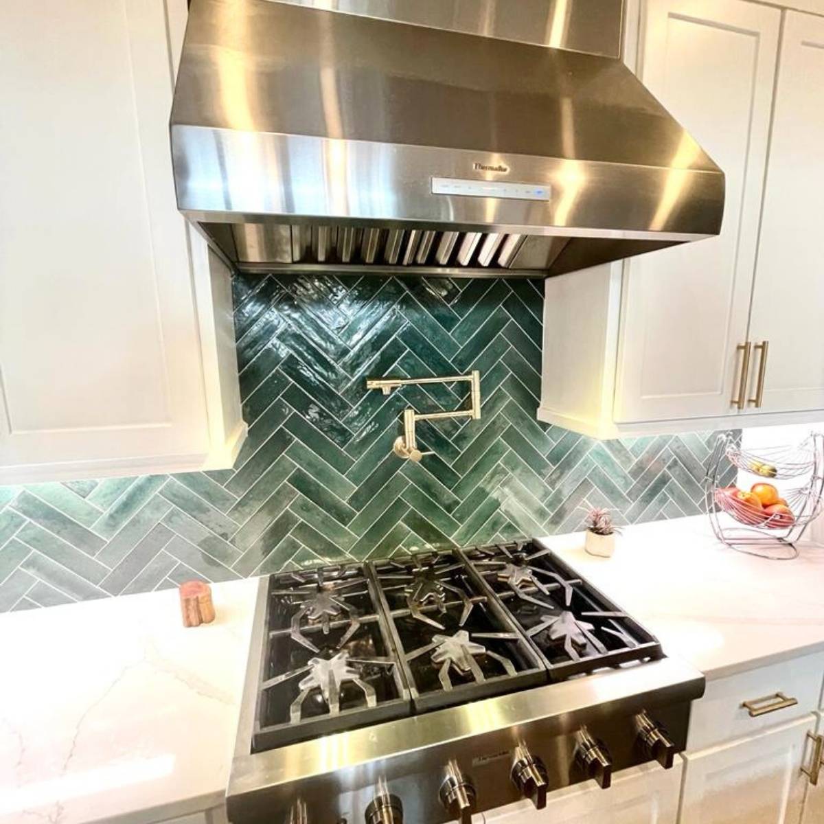 After: Bright modern Austin kitchen renovation - stainless steel applicances and herringbone tile backsplash