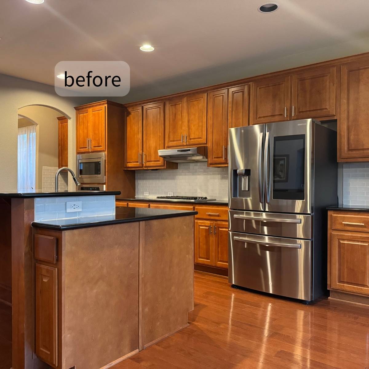 Before: Outdated Austin home kitchen with dark cabinets and poor lighting