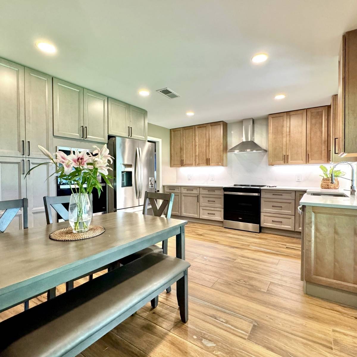 After: Contemporary Austin kitchen by ATX Custom Remodel featuring open layout & stainless steel appliances