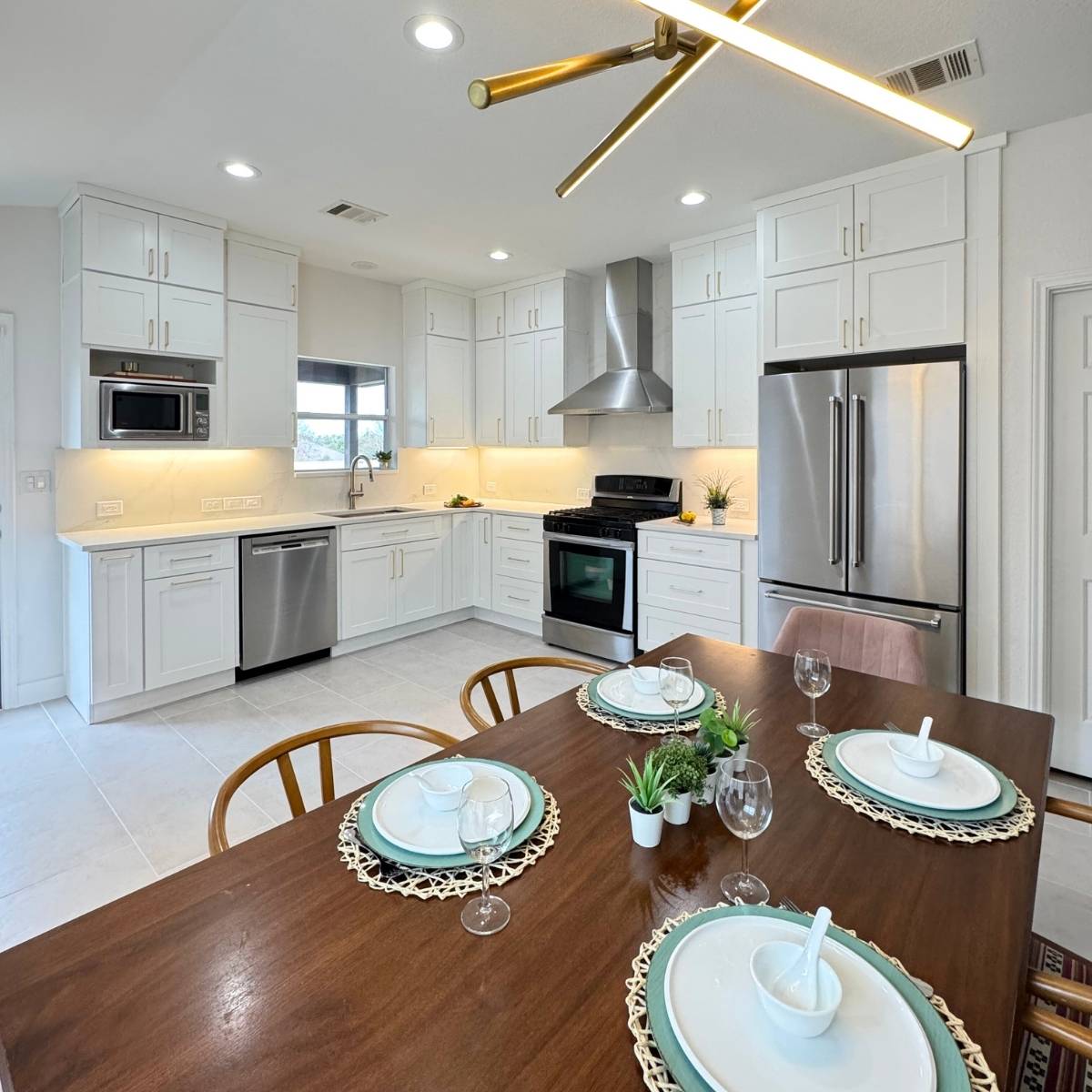 After: Bright modern Austin kitchen renovation with wall removed for open layout