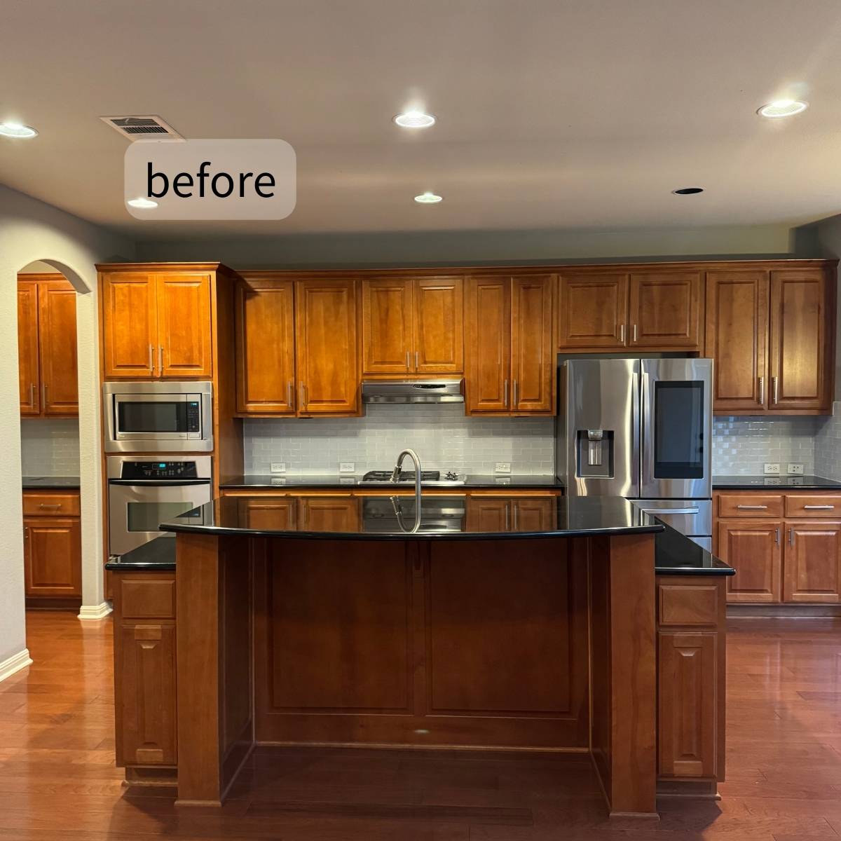 Before: Outdated Austin home kitchen with dark cabinets and poor lighting