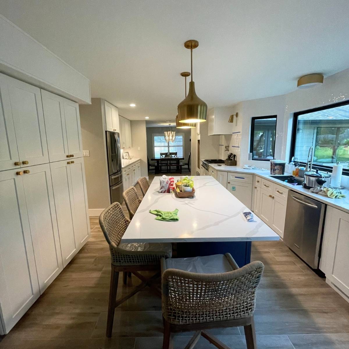 After: Open concept Austin kitchen transformation with quartz counters and stainless appliances