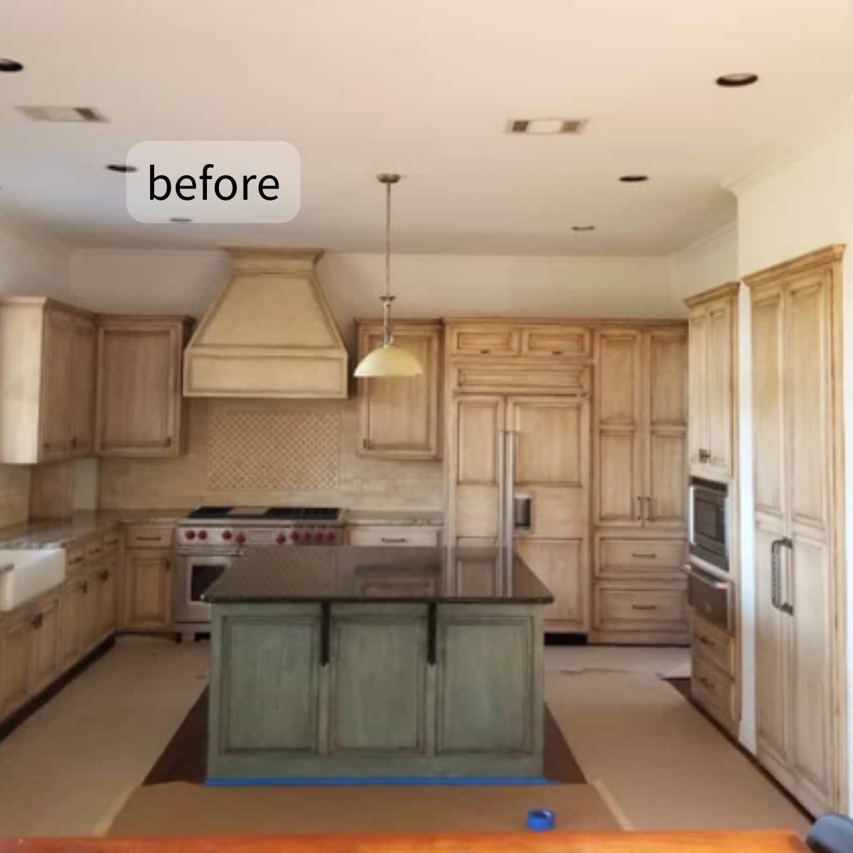 Before: Austin TX kitchen needing remodel - faded cabinets, chipped tile, and small island