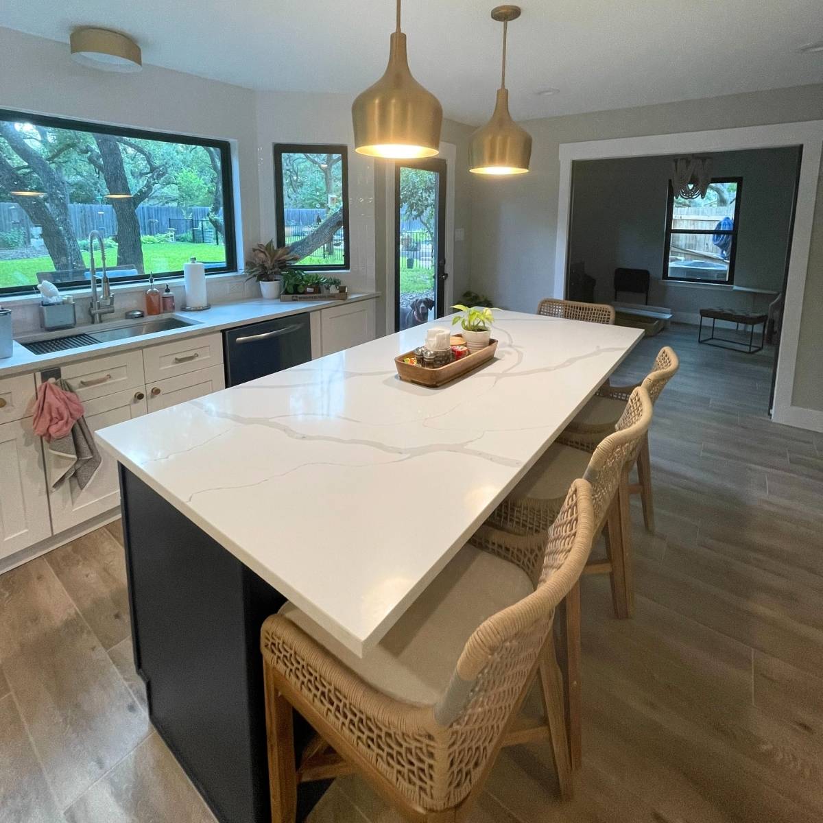 Beautiful Austin Kitchen after remodel, large quartz island and pendant lights