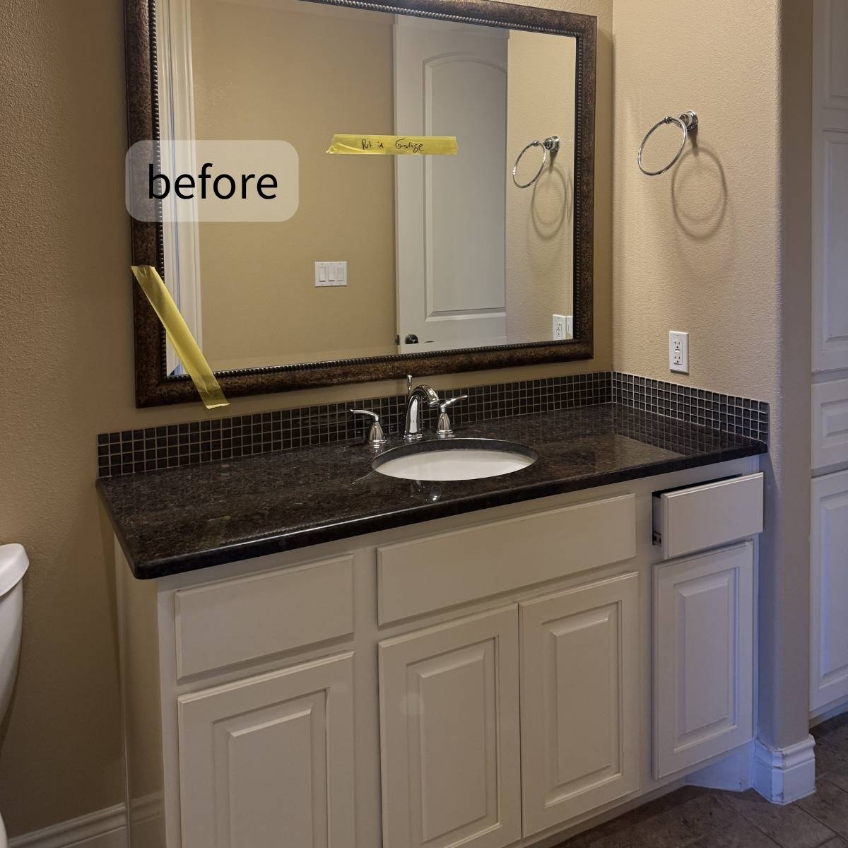 Small dated bathroom before remodel with old vanity and tile floor in Austin home