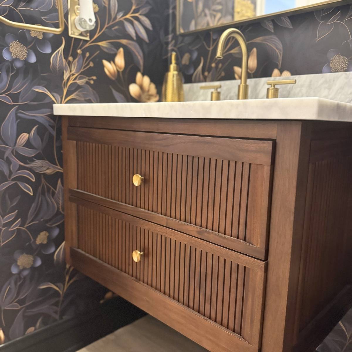 Modern Austin powder room remodel with floating vanity and beautiful fixtures