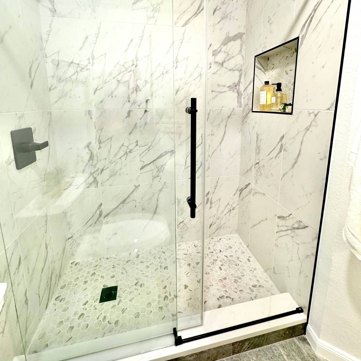 Bright custom walk-in shower bathroom after remodel with custom tile 