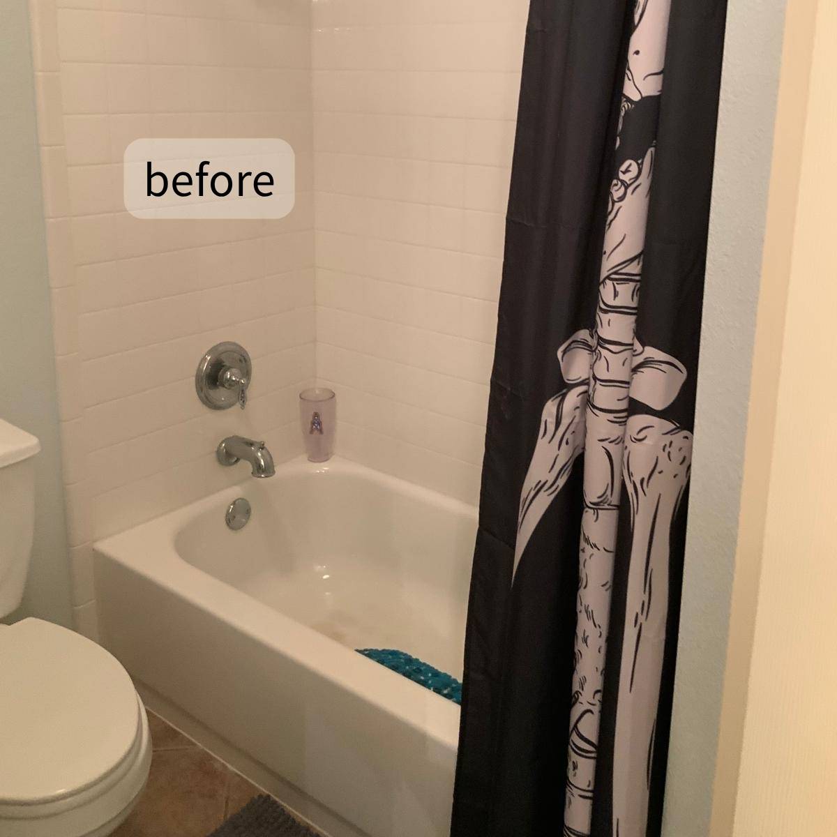 Outdated bathroom before remodel showing old tub and basic flooring