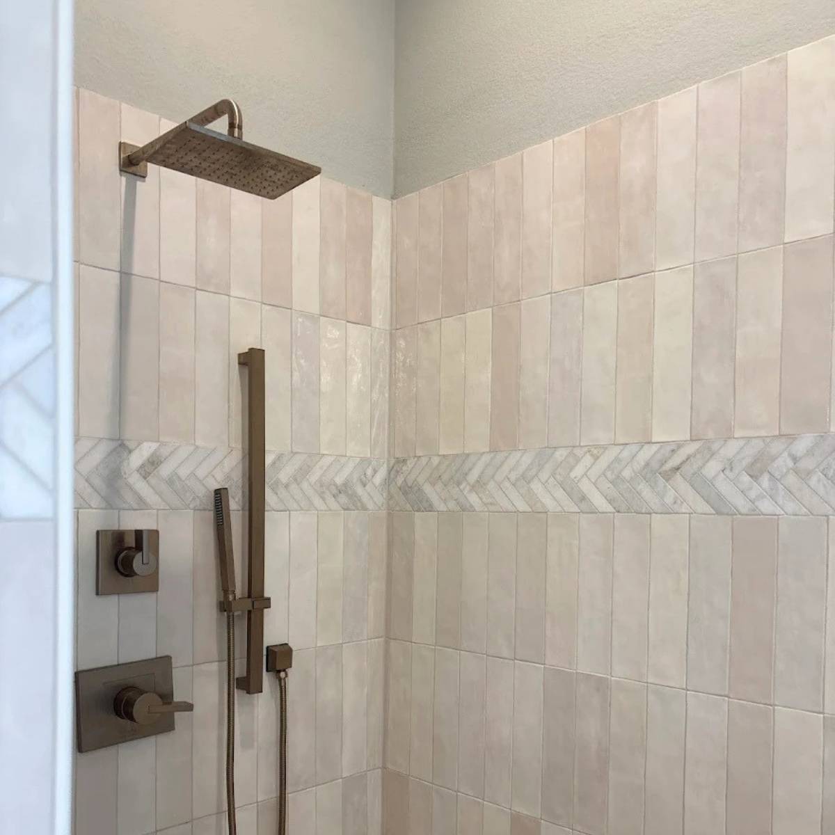 After: Spa-style walk-in shower after bathroom renovation with frameless glass and custom tile in Austin