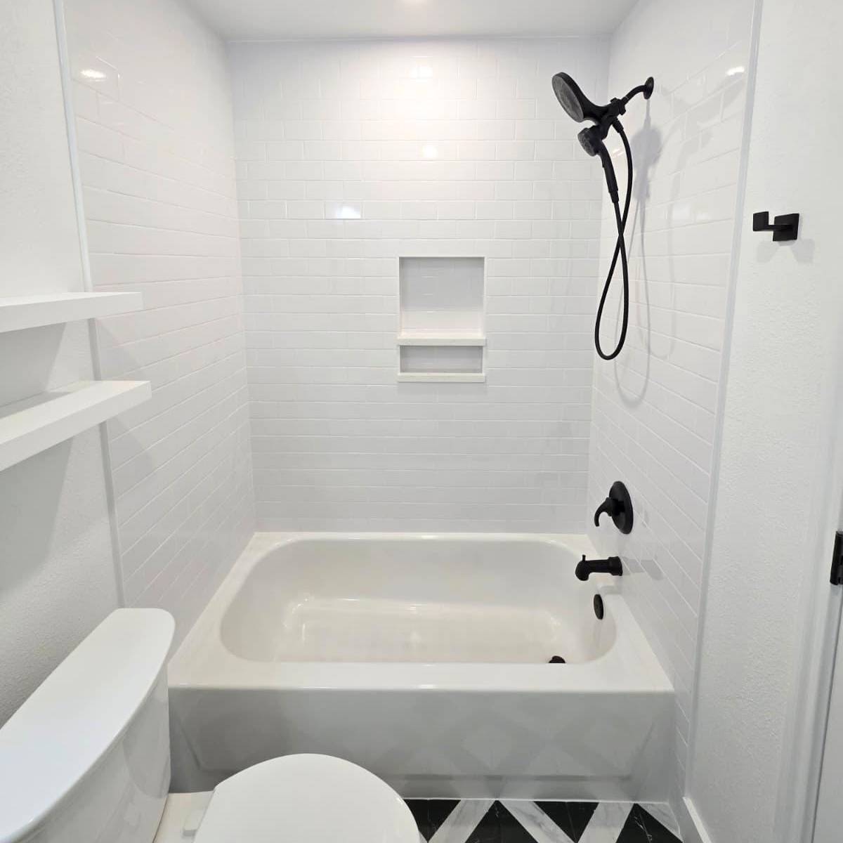 Bright Austin bathroom after makeover with new vanity, custom tile, and modern black fixtures