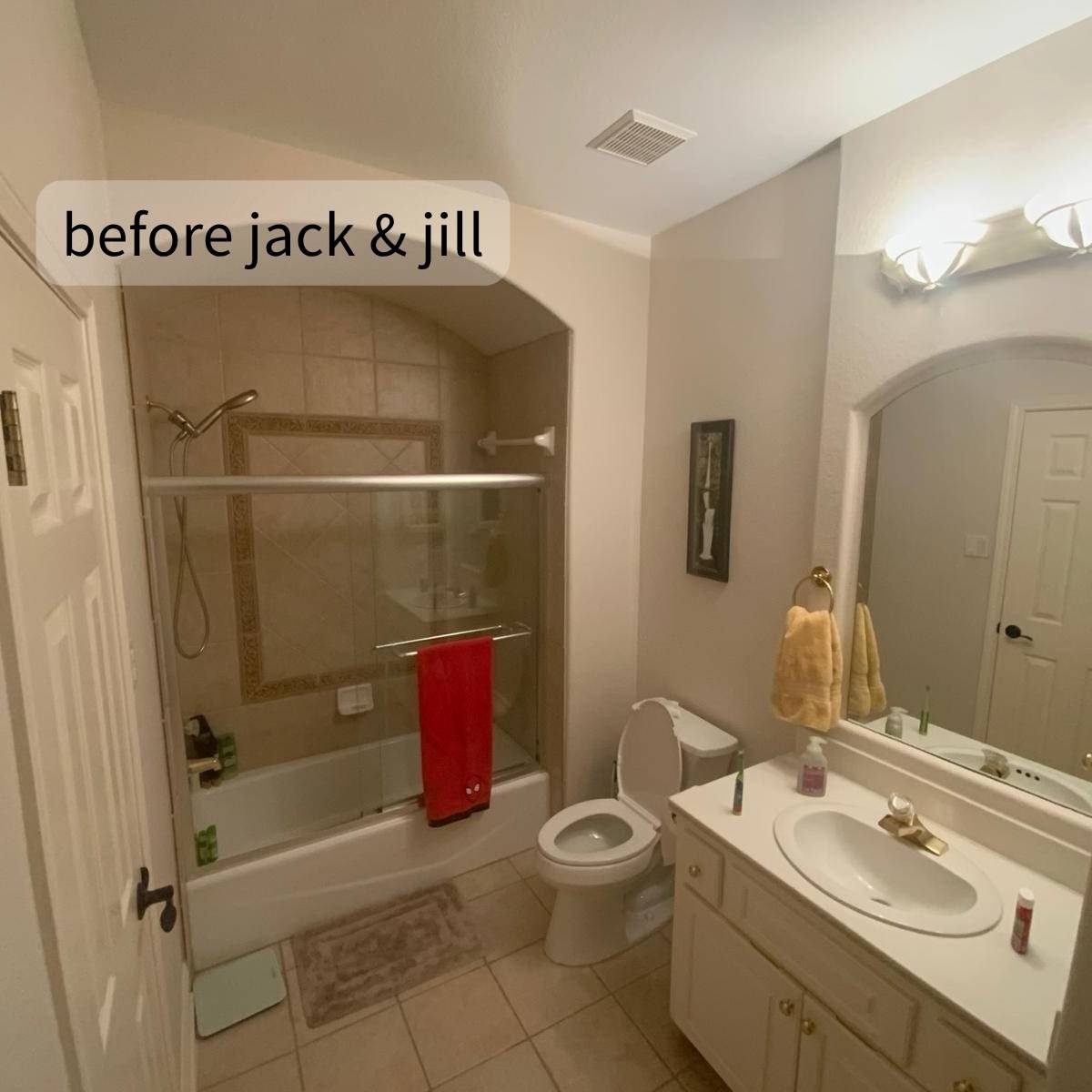 Cramped jack & jill bathroom before redesign into 2 separate bathrooms with limited storage and aging fixtures