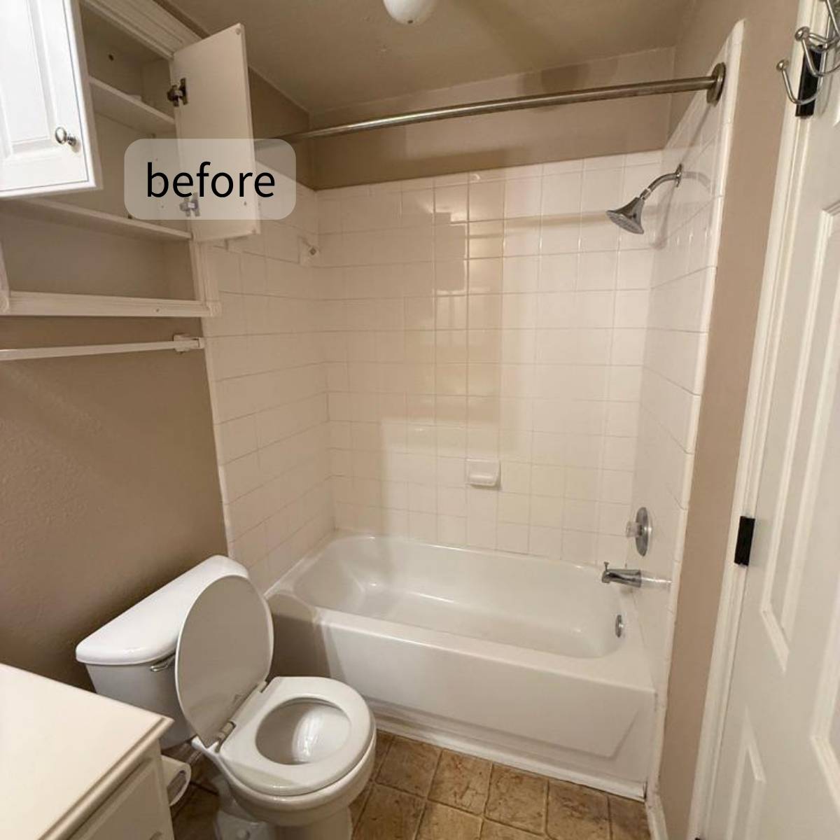 Bathroom before renovation with low lighting old tub & tile