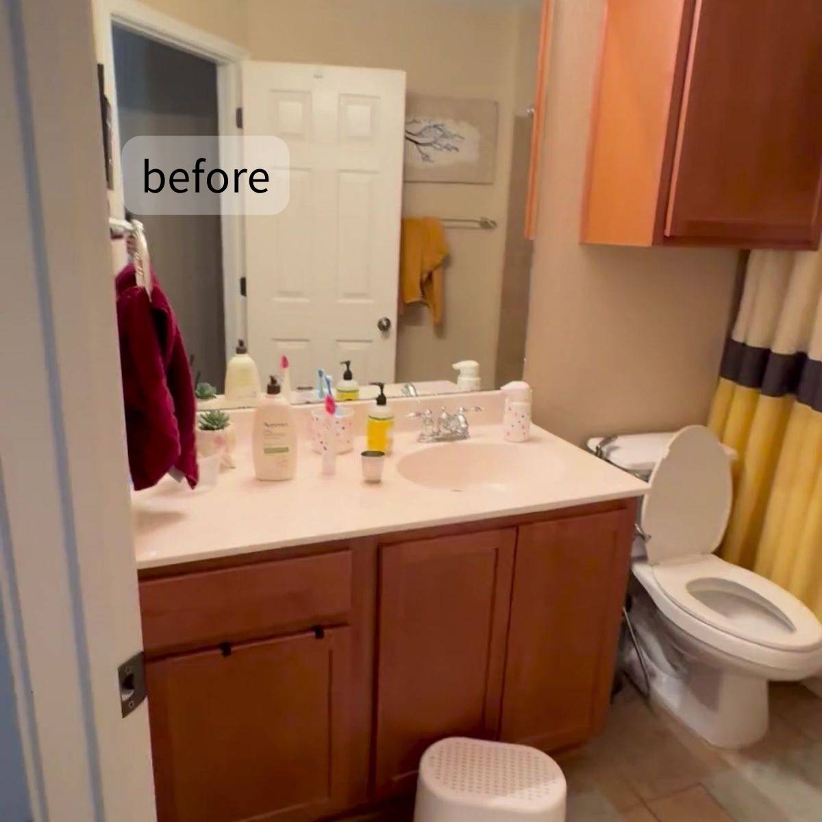 Cramped bathroom before redesign with limited storage and aging fixtures