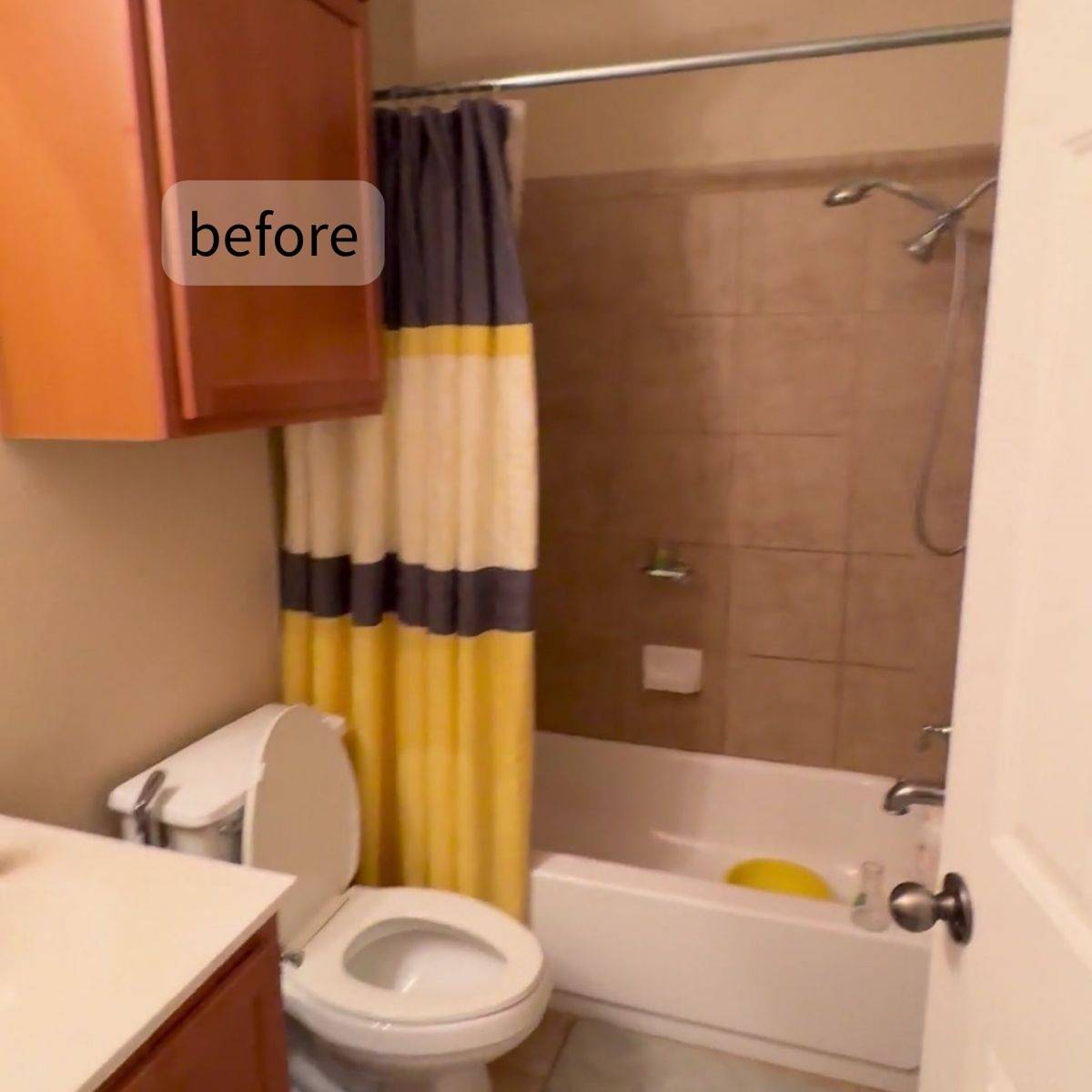 Cramped bathroom before redesign with old tile and dark cabinets