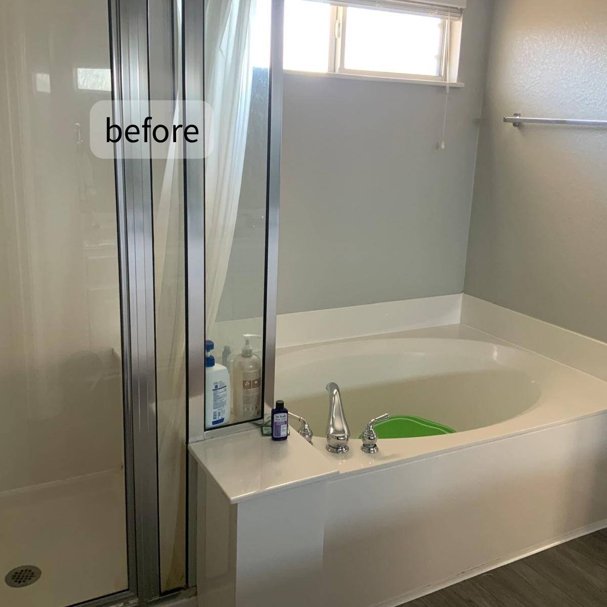 original bathroom before renovation in Austin TX with old connected tub & shower design
