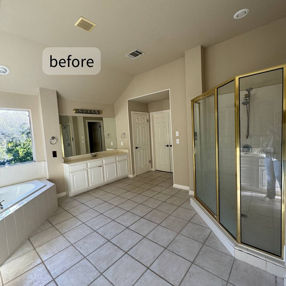 before primary bathroom remodel showing old tile, outdated gold trim and outdated fixtures Austin home