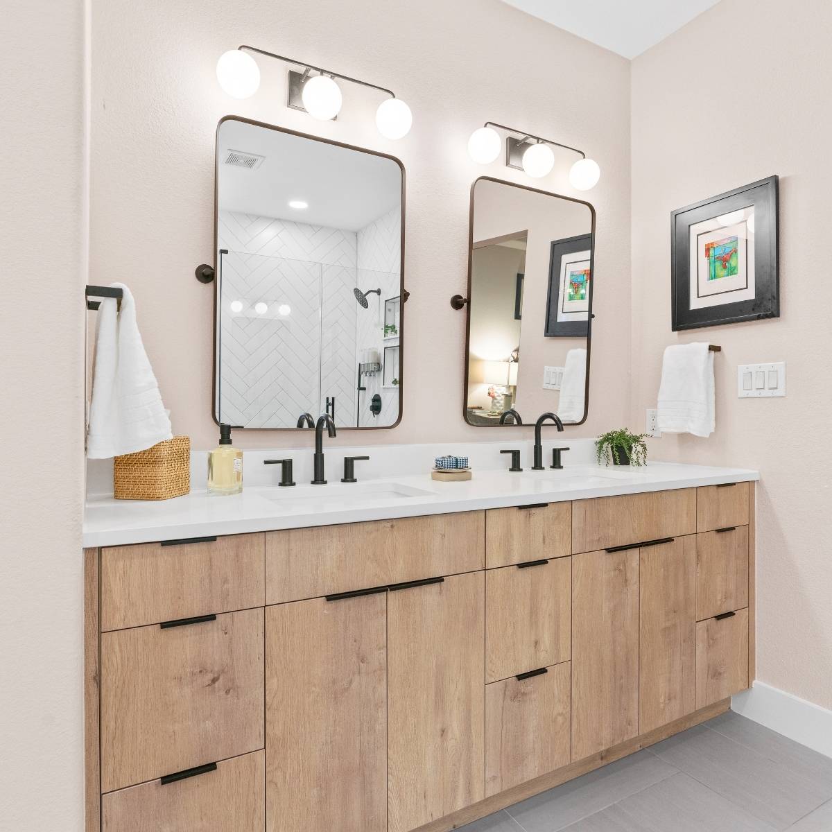 After: Bright modern Austin guest bathroom with matte black fixtures and light vanity