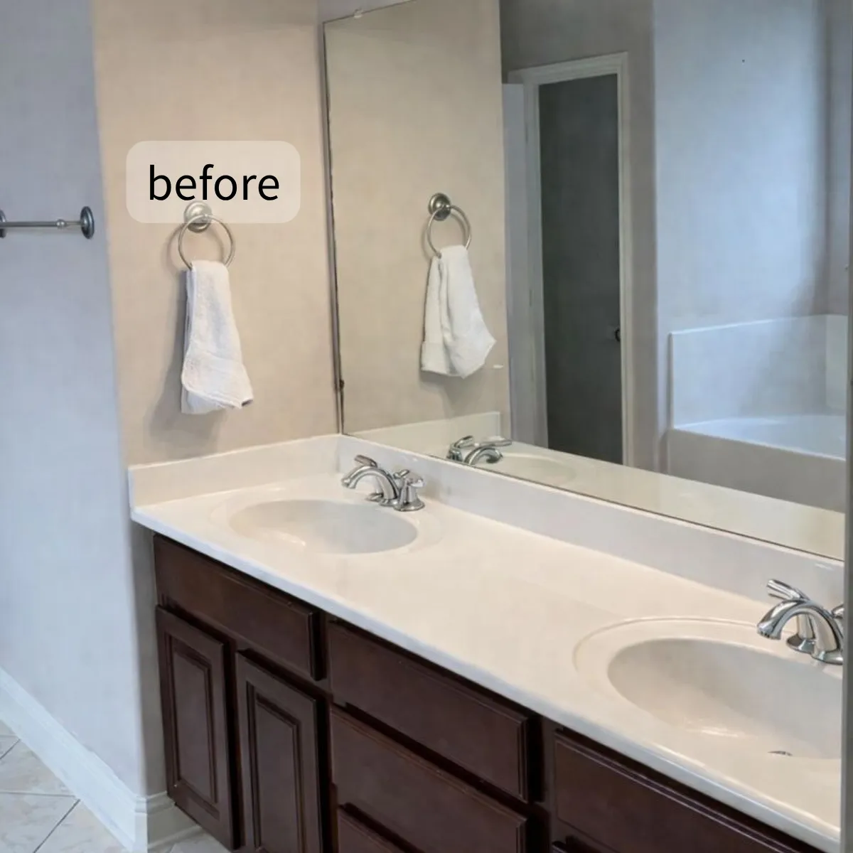 Before: Austin bathroom before remodel - no storage, dark cabinets