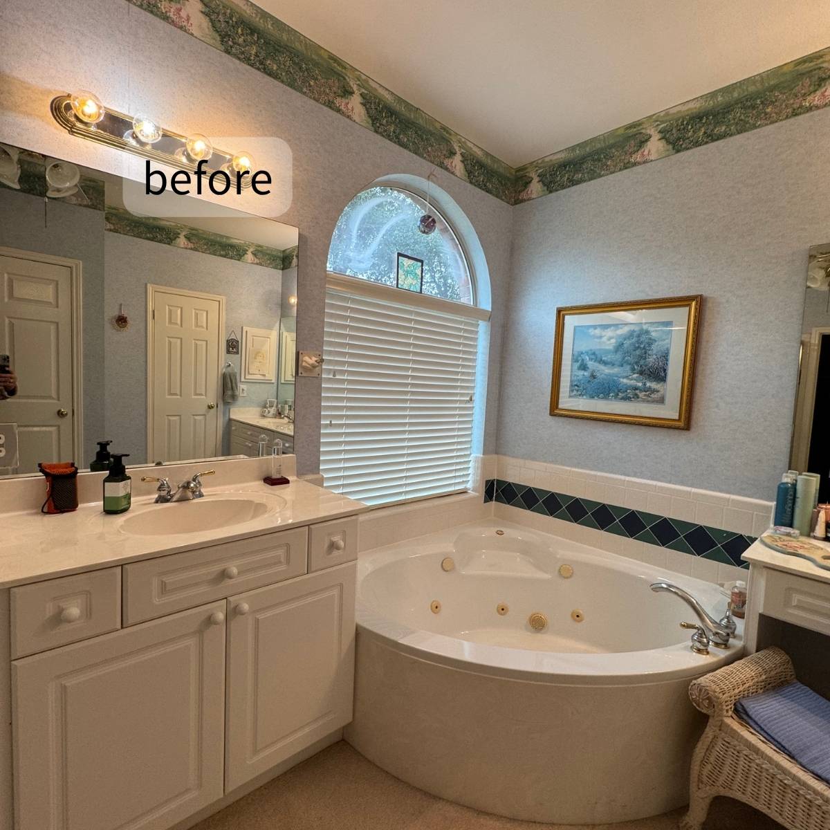 Before: Outdated Austin bathroom with wallpaper and carpet