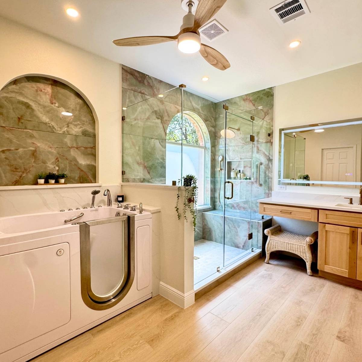 After: Spa-like Austin aging-in-place primary bathroom remodel with custom tiled shower with built in bench