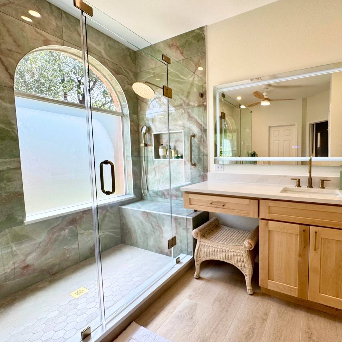 After: Bright modern Austin primary bathroom with modern fixtures and free-standing vanity