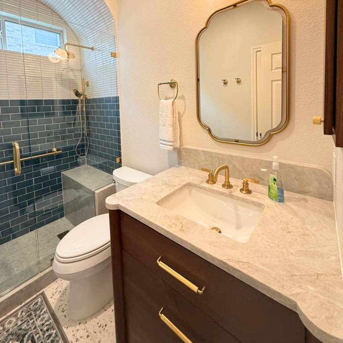 After: Spa-like Austin bathroom remodel with frameless glass shower with inserts, custom tile