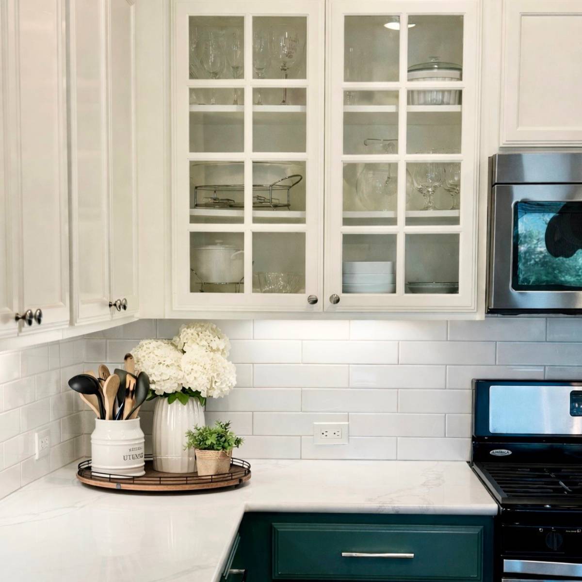Updated kitchen refresh in Leander featuring painted teal lower cabinets, white upper cabinets, new quartz countertops, white subway tile backsplash, and updated modern finishes by ATX Custom Remodel