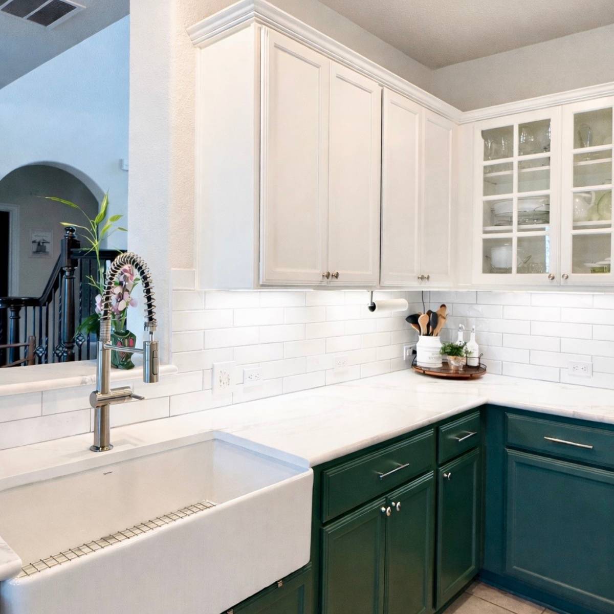 Modern kitchen refresh in Leander featuring painted cabinets, new quartz countertops, white subway tile backsplash, farmhouse sink, and updated modern finishes by ATX Custom Remodel