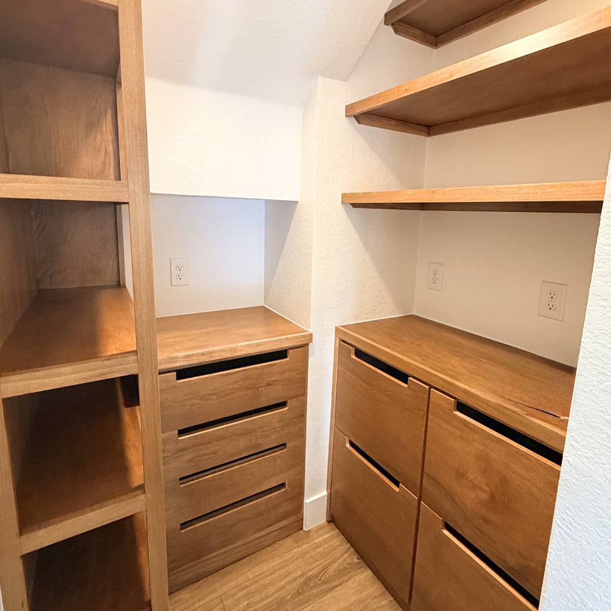 Warm wood cabinetry, open shelves, and smart built-in storage in a specialty room under stair Austin butler pantry remodel.